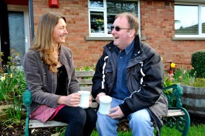 Woman and man drinking tea together
