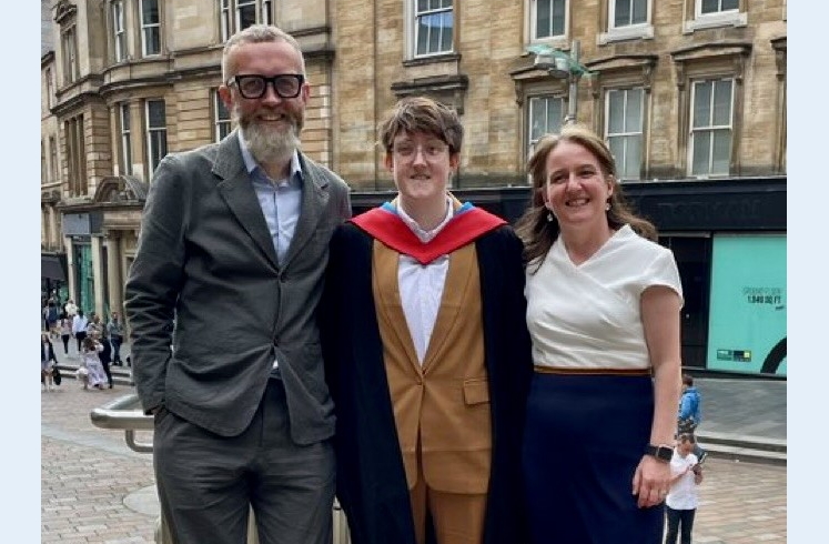 John Todd, heart attack survivor, stands with his family at a graduation.