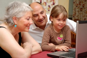 Family searching for information on laptop