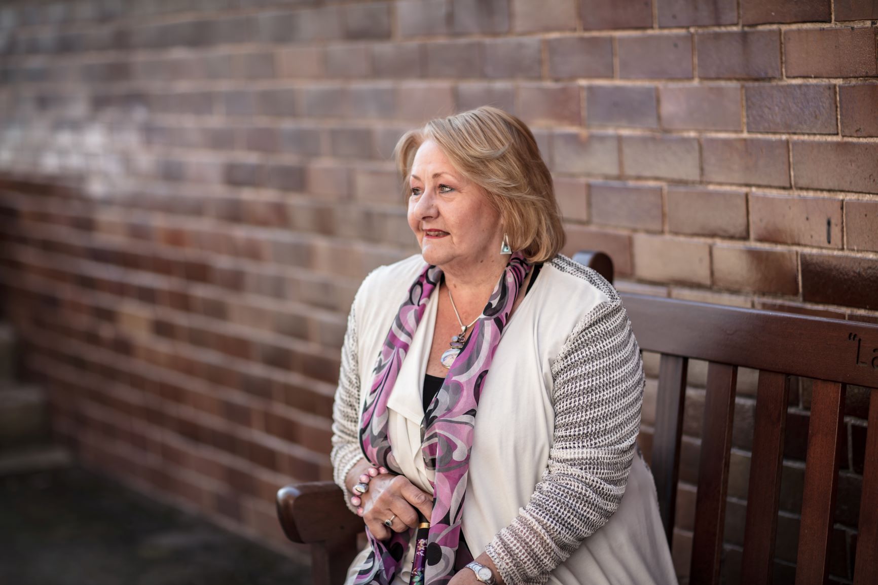 woman sitting alone on bench -mental health and wellbeing coronavirus