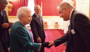 Dr Douglas Stuart is introduced to HM The Queen